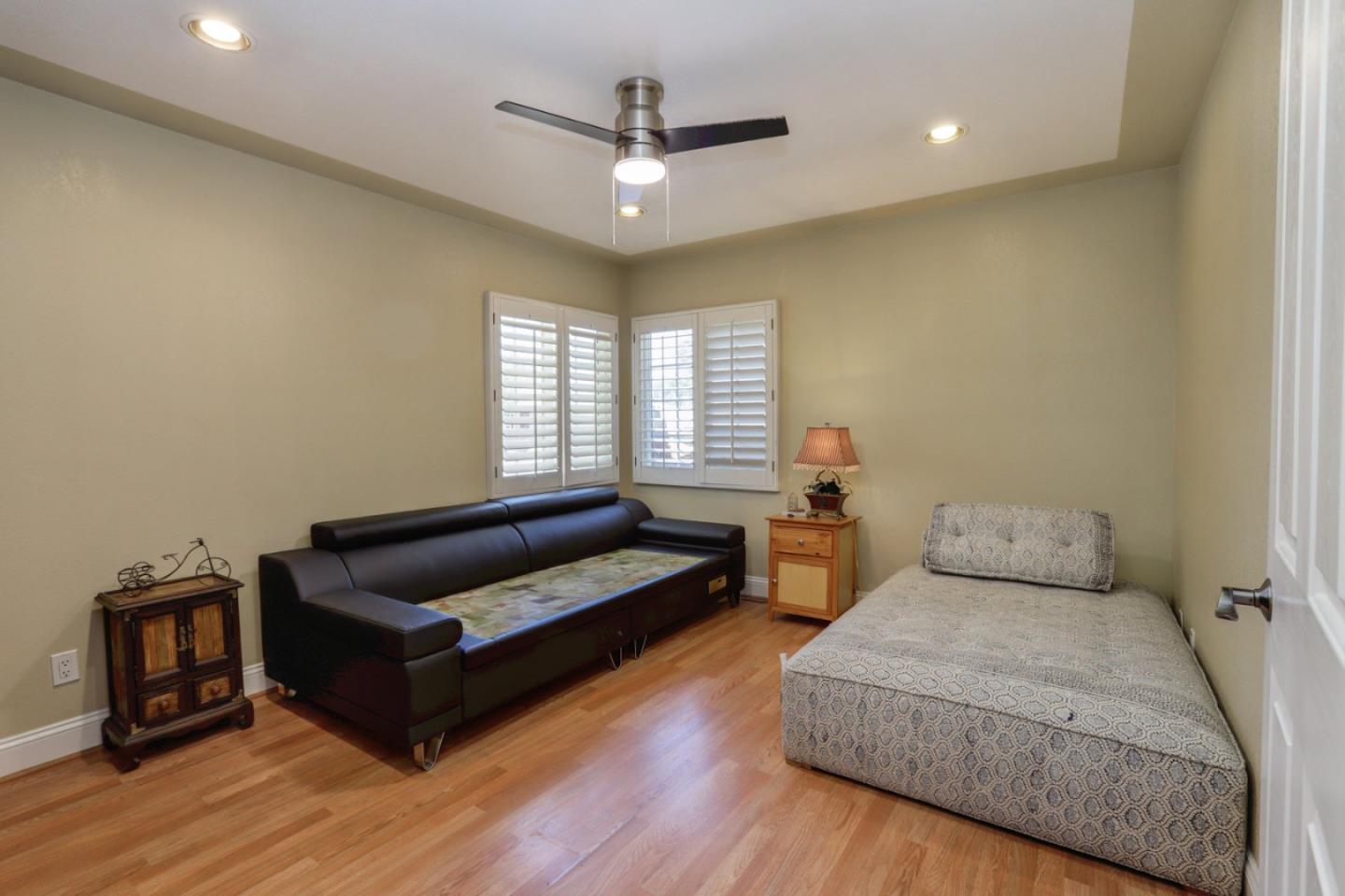60 Monte Vista Way Gilroy, CA 95020 - Photo 17 of 33 a bedroom with furniture and a wooden floor