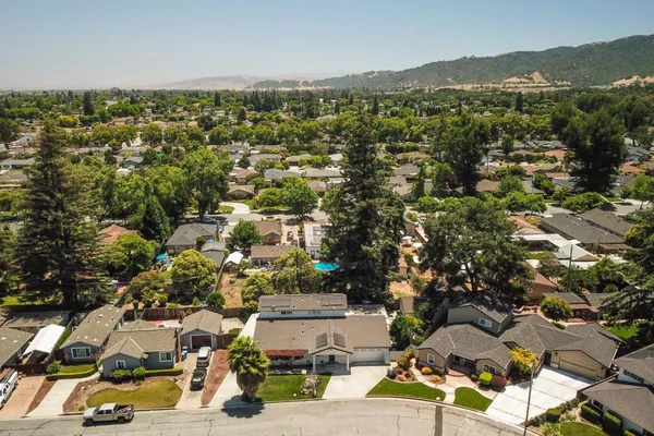an aerial view of residential houses with outdoor space