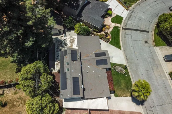 an aerial view of residential houses with outdoor space