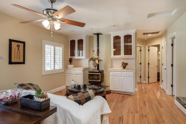 a living room with furniture and fireplace