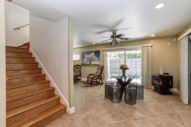 a view of a livingroom with furniture and a large window