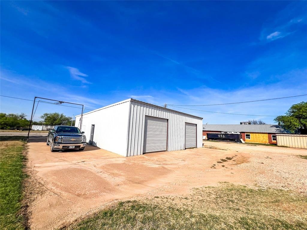 704 North 1st Street Haskell, TX 79521 - Photo 4 of 13 a view of a house with a patio