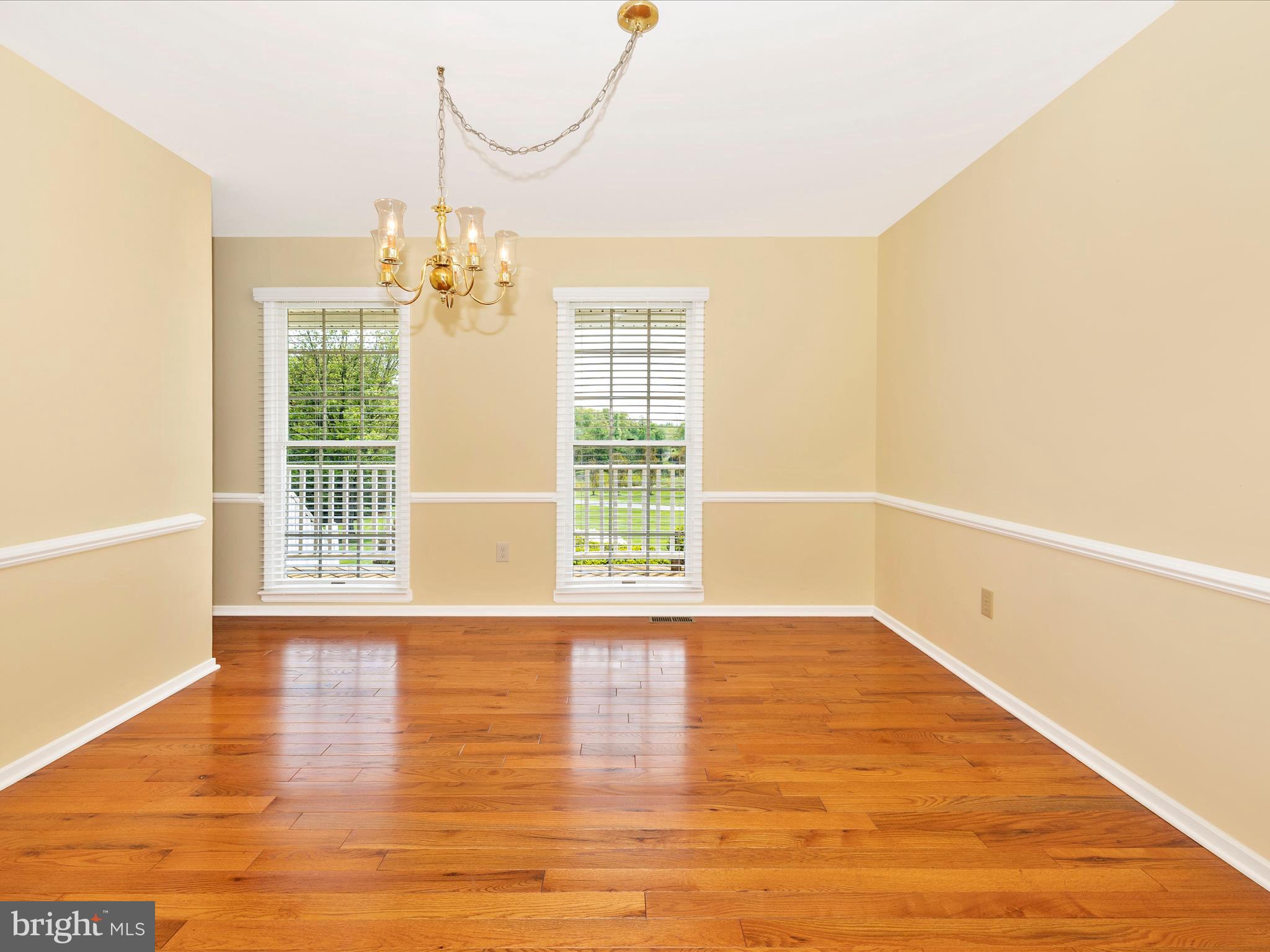 4503 Bartholows Road Mount Airy, MD 21771 - Photo 12 of 65 a view of an empty room with wooden floor and a window