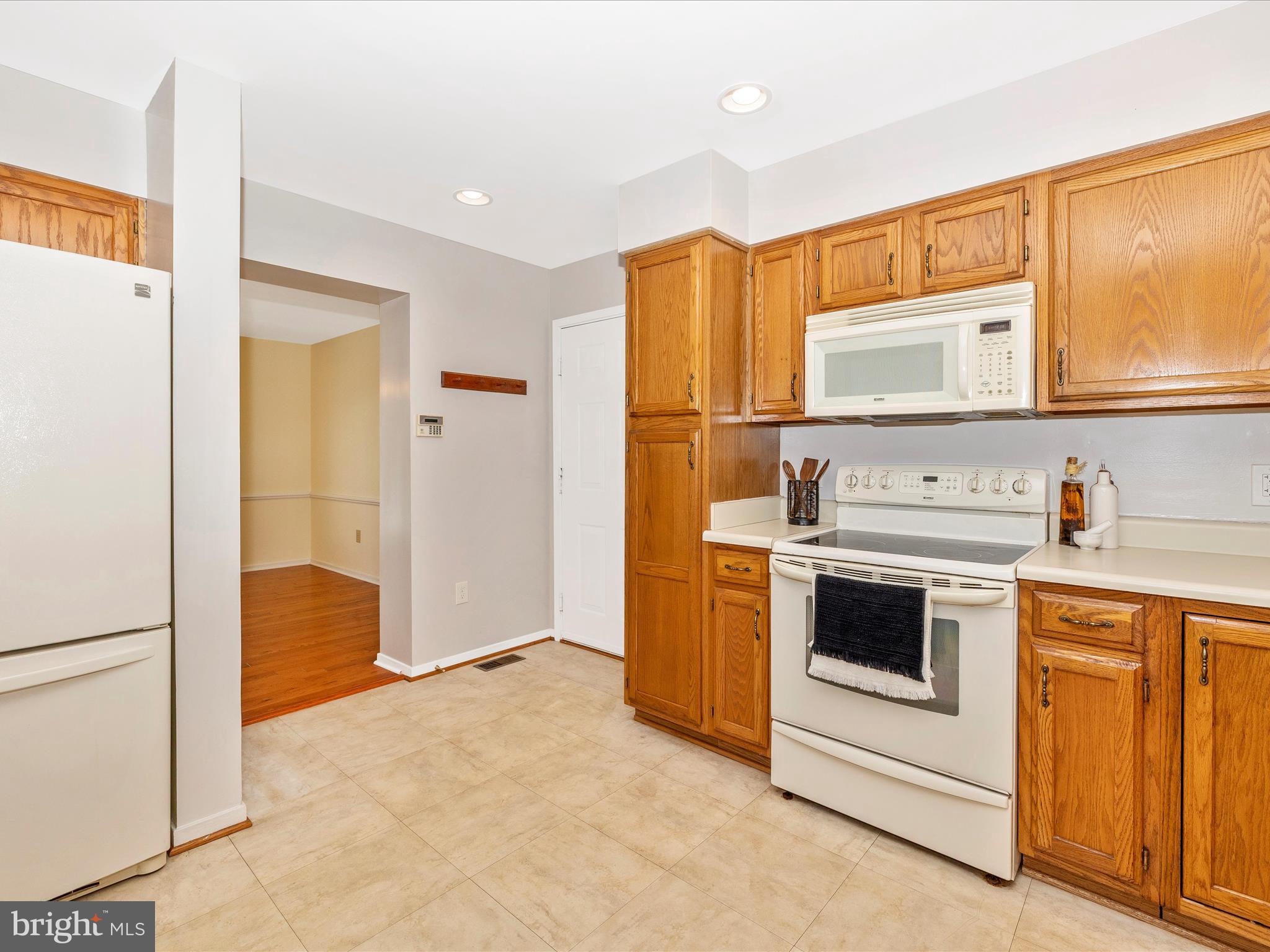 4503 Bartholows Road Mount Airy, MD 21771 - Photo 17 of 65 a kitchen with stainless steel appliances granite countertop a stove and a refrigerator