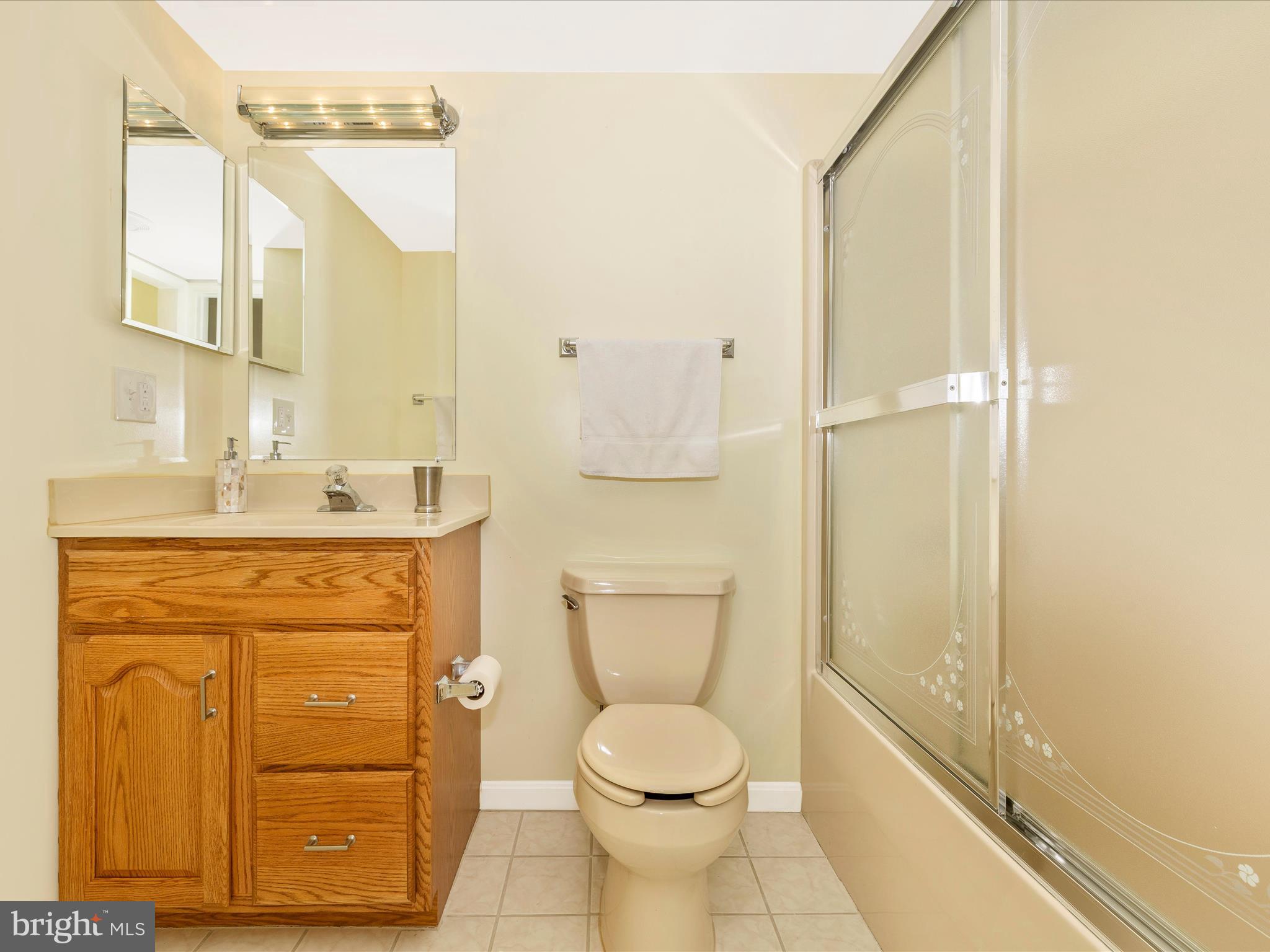 4503 Bartholows Road Mount Airy, MD 21771 - Photo 40 of 65 a bathroom with a granite countertop toilet sink and mirror