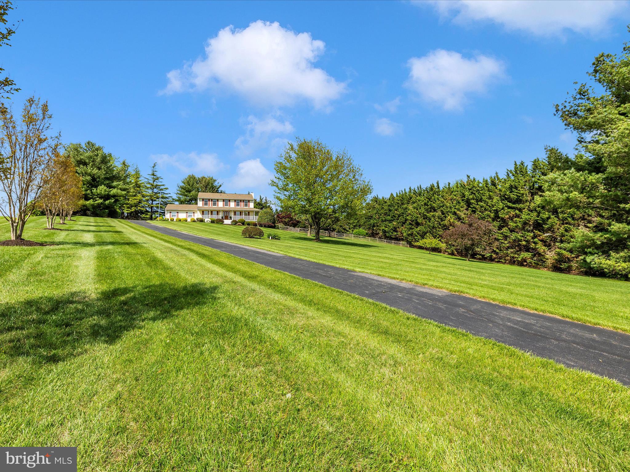 4503 Bartholows Road Mount Airy, MD 21771 - Photo 47 of 65 a view of a golf course with a lake