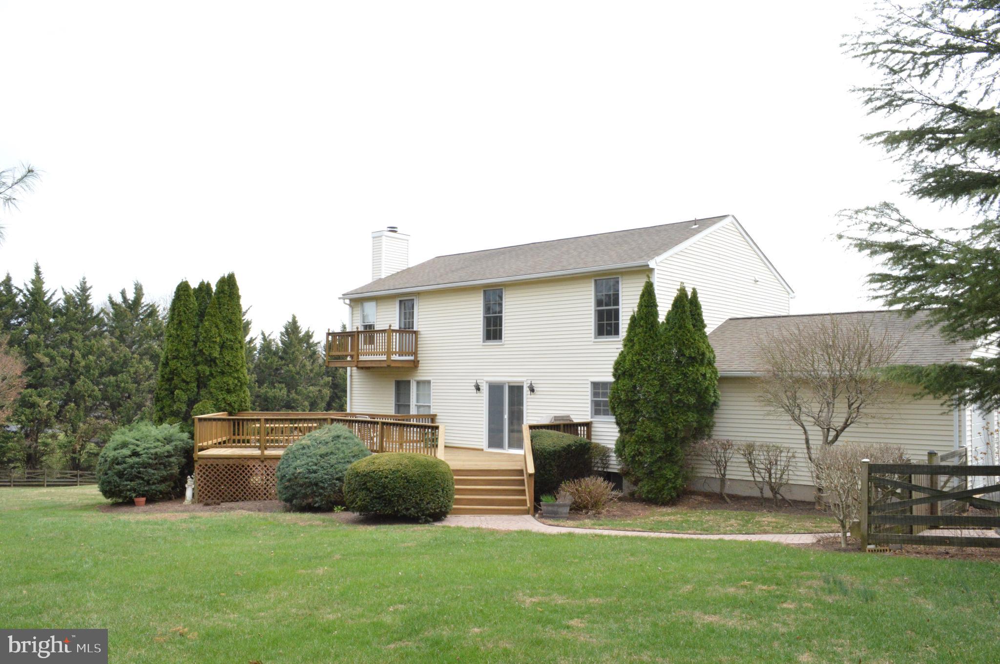 4503 Bartholows Road Mount Airy, MD 21771 - Photo 52 of 65 a view of a house with a yard and sitting area
