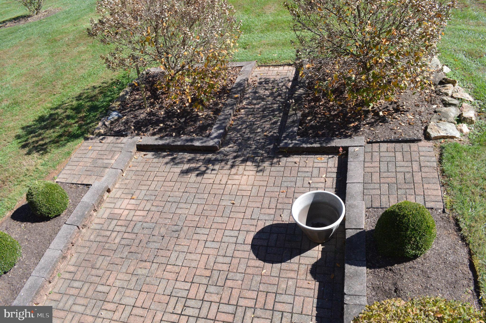 4503 Bartholows Road Mount Airy, MD 21771 - Photo 56 of 65 a backyard of a house with lots of green space and glass windows