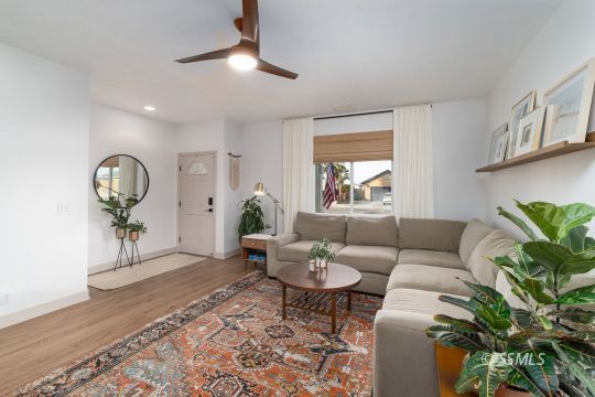925 West Coronado Avenue Ridgecrest, CA 93555 - Photo 3 of 33 a living room with furniture potted plant and a window
