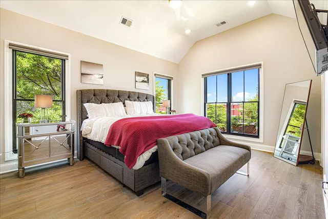 a bedroom with a bed and a couch