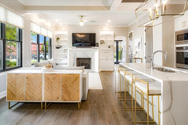 a living room with fireplace furniture and a flat screen tv