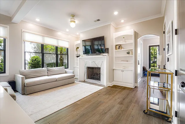 a living room with furniture fireplace and flat screen tv