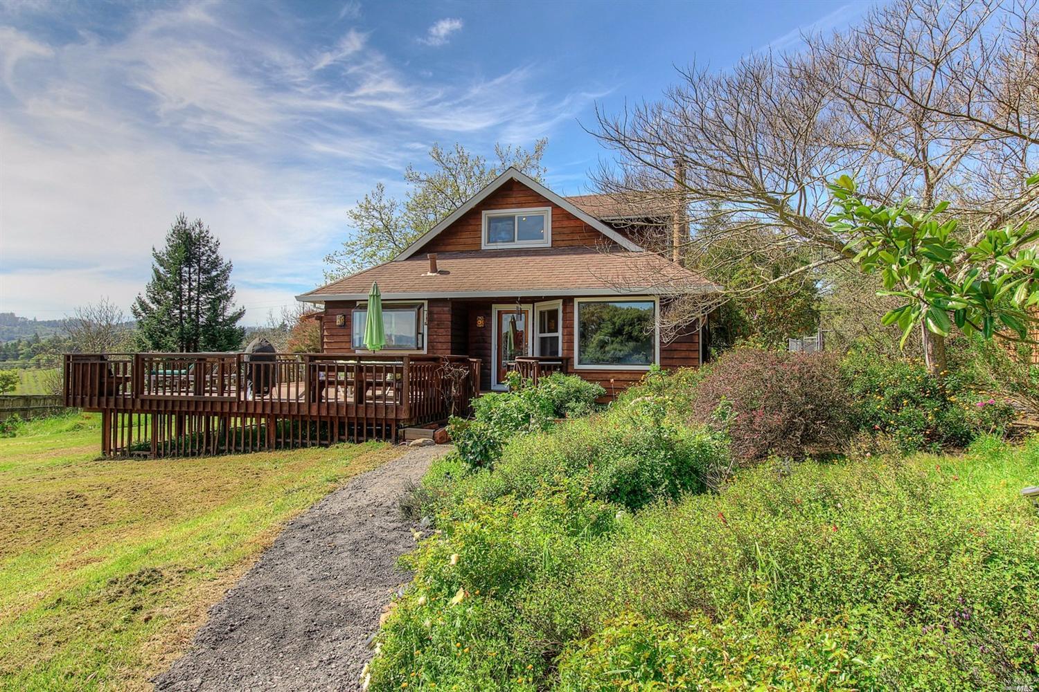 1298 Burnside Road Sebastopol, CA 95472 - Photo 1 of 1 a house view with a garden space