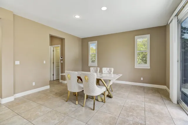 a large kitchen with kitchen island granite countertop a large counter top and stainless steel appliances