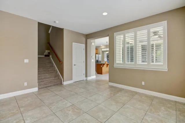 a view of kitchen with granite countertop cabinets