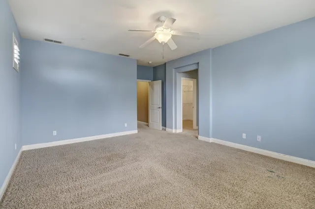 a spacious bathroom with a large tub shower and sink