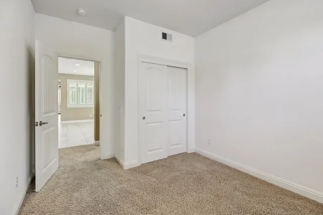 a house view with a sitting space and garden