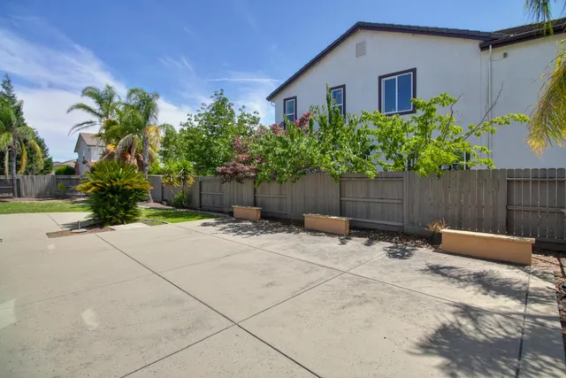 a spacious bedroom with a bed and a couch