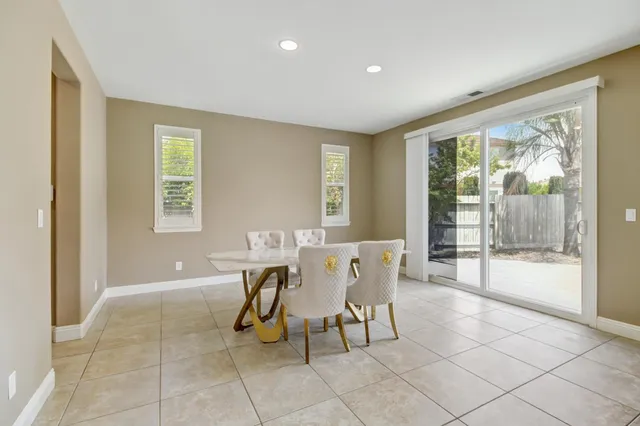 a view of a room with furniture and windows