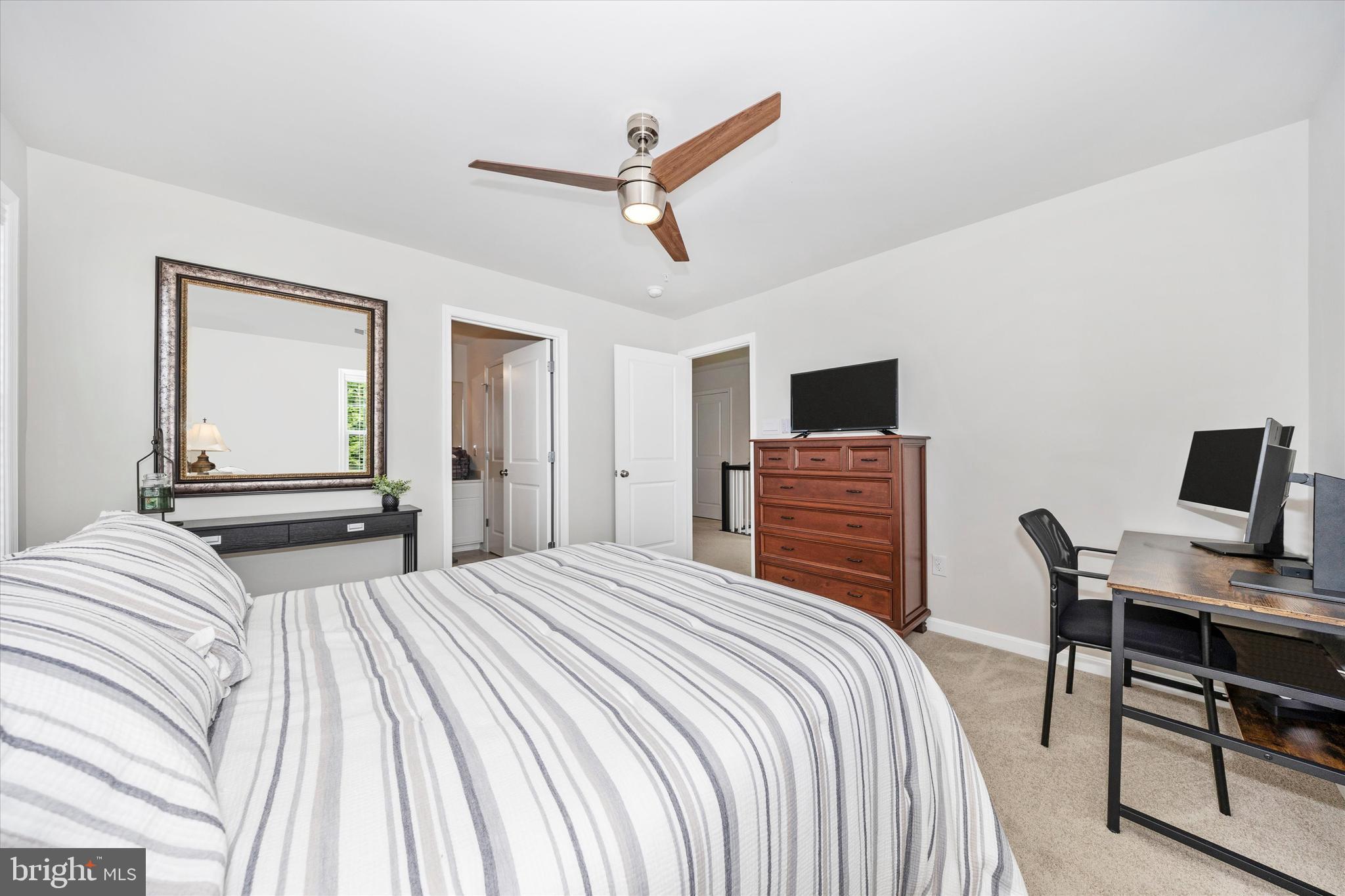 700 Bond Street Frederick, MD 21701 - Photo 25 of 49 a bedroom with a bed and a flat screen tv