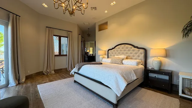 a bedroom with a bed couch and window