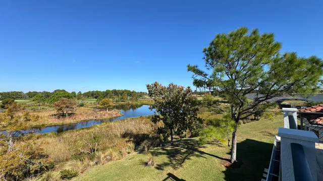 a front view of a house with garden and patio
