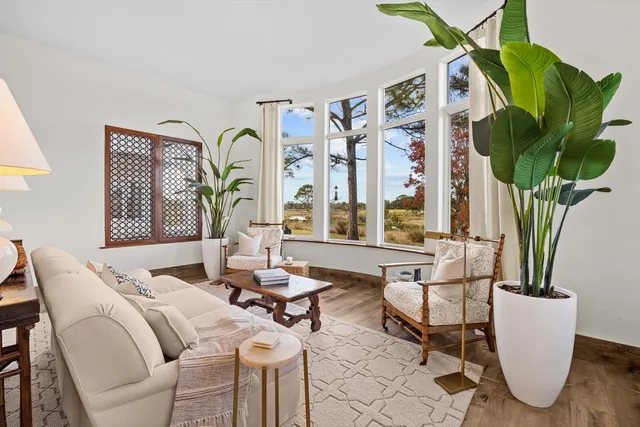 a kitchen with a stove and a white wooden cabinets