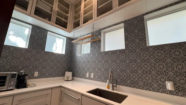 a kitchen with a sink and cabinets
