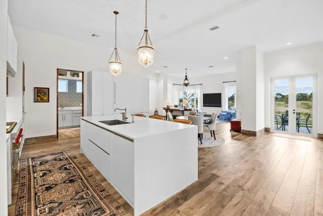 a kitchen with a sink and cabinets