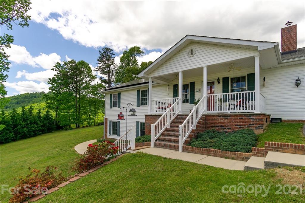 116 Kay Road Flat Rock, NC 28731 - Photo 1 of 36 a front view of house with a garden