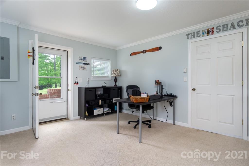 116 Kay Road Flat Rock, NC 28731 - Photo 23 of 36 a work room with furniture and a window