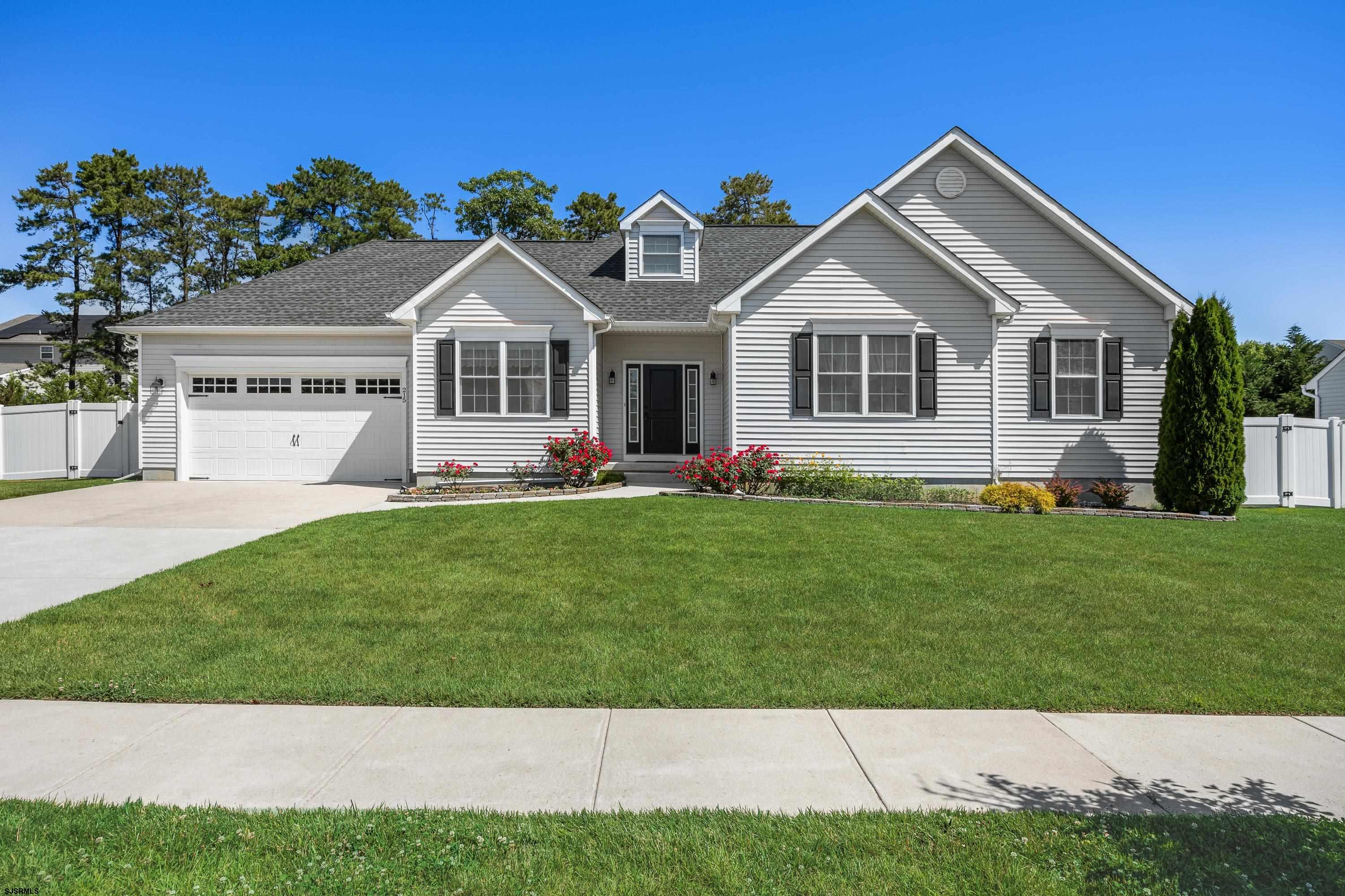 215 Surf Road Egg Harbor Township, NJ 08234 - Photo 1 of 31 a front view of house with yard and green space