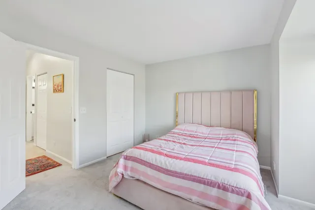 a bedroom with a bed and a cabinets