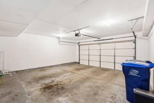 a picture of a bench in front of a white house