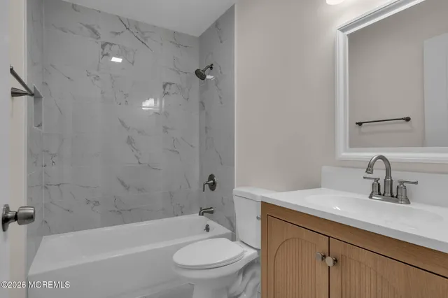 a bathroom with a sink toilet and bathtub