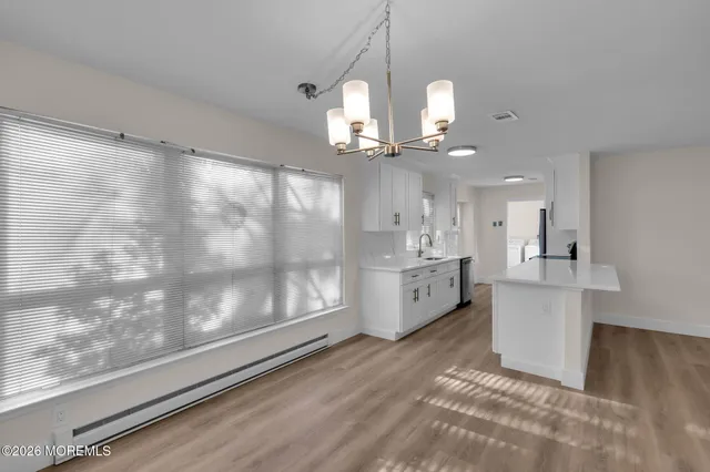 a view of a kitchen with appliances and cabinets