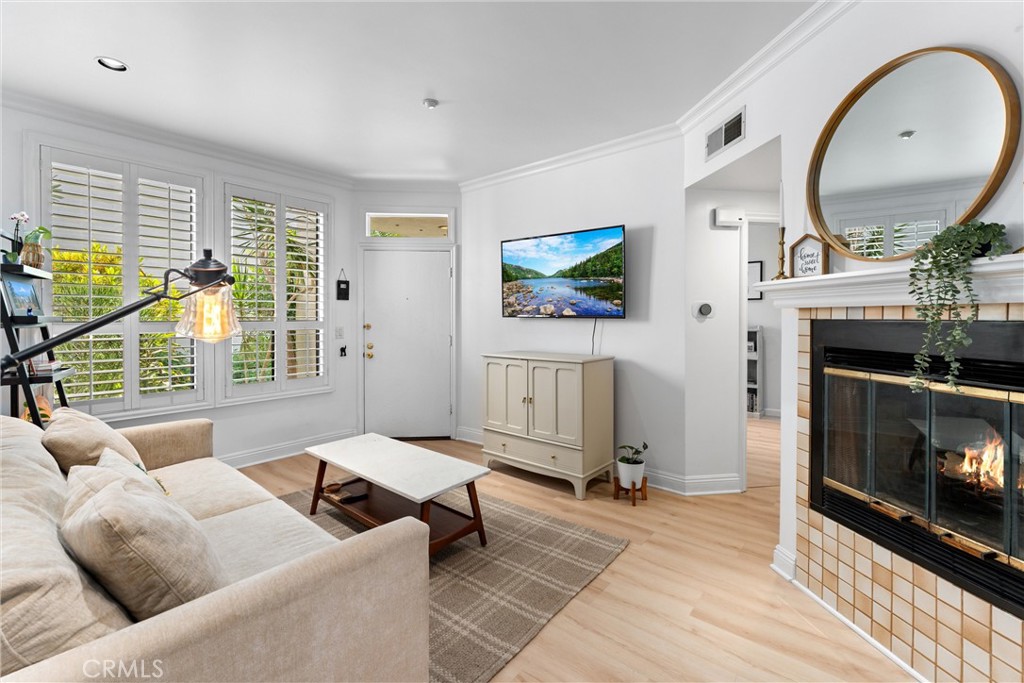 1340 Glenwood Road, Unit 28 Glendale, CA 91201 - Photo 1 of 36 a living room with furniture a fireplace and a flat screen tv
