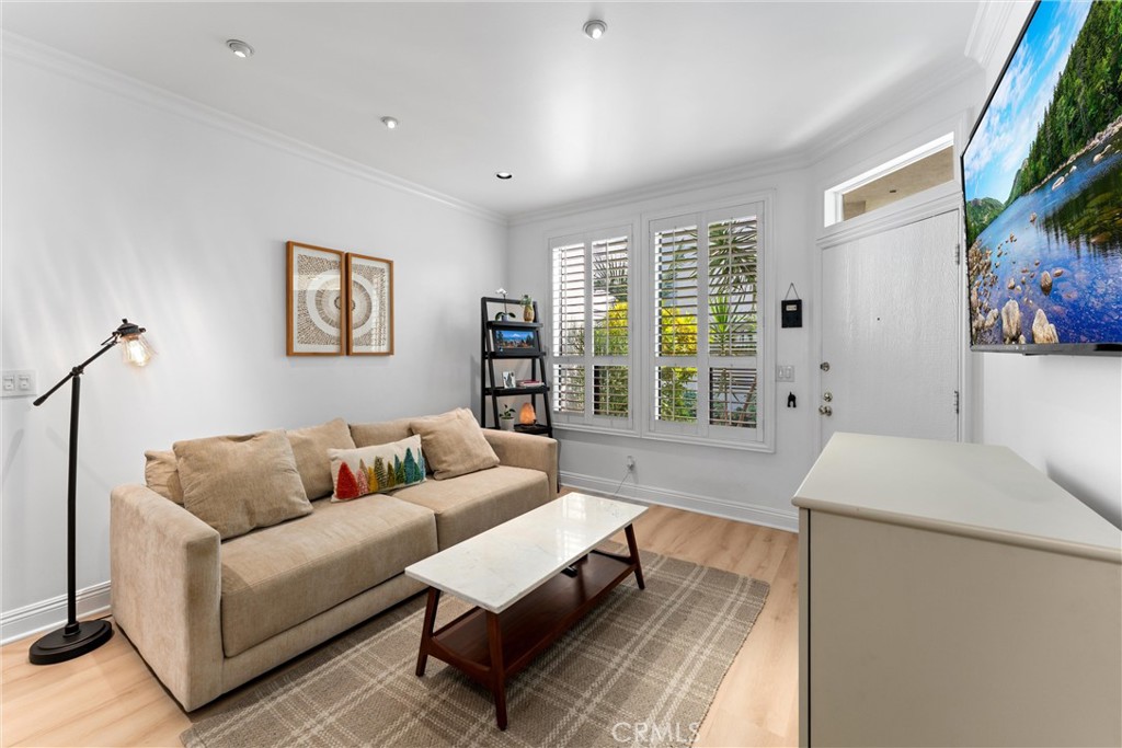 1340 Glenwood Road, Unit 28 Glendale, CA 91201 - Photo 11 of 36 a living room with furniture and a flat screen tv