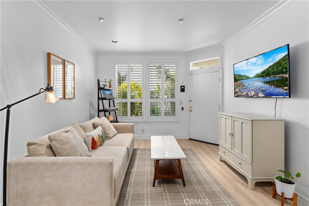 1340 Glenwood Road, Unit 28 Glendale, CA 91201 - Photo 12 of 36 a living room with furniture and a flat screen tv