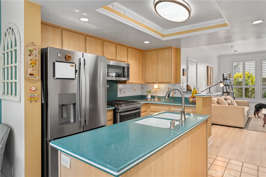 1340 Glenwood Road, Unit 28 Glendale, CA 91201 - Photo 15 of 36 a kitchen with stainless steel appliances granite countertop a refrigerator a stove and a sink