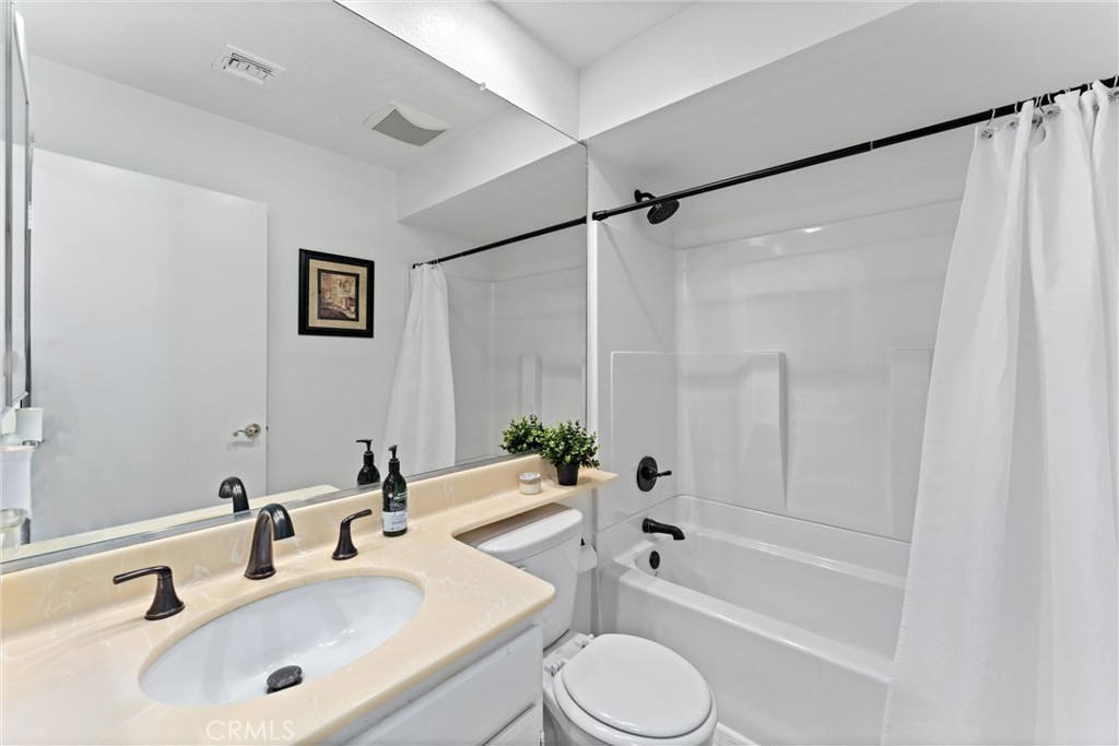 1340 Glenwood Road, Unit 28 Glendale, CA 91201 - Photo 20 of 36 a bathroom with a bathtub shower sink vanity and toilet