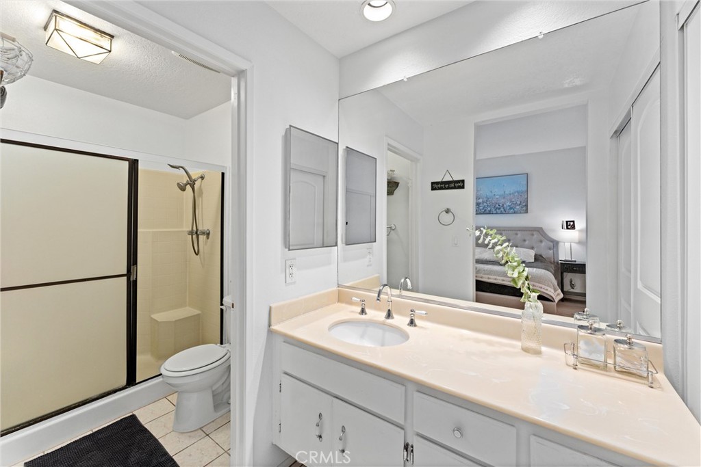 1340 Glenwood Road, Unit 28 Glendale, CA 91201 - Photo 23 of 36 a bathroom with a sink toilet a mirror and shower