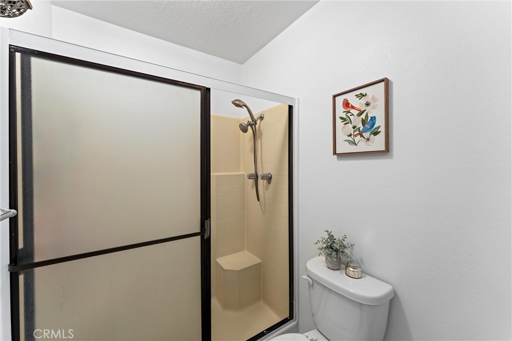 1340 Glenwood Road, Unit 28 Glendale, CA 91201 - Photo 24 of 36 a bathroom with a shower and a toilet