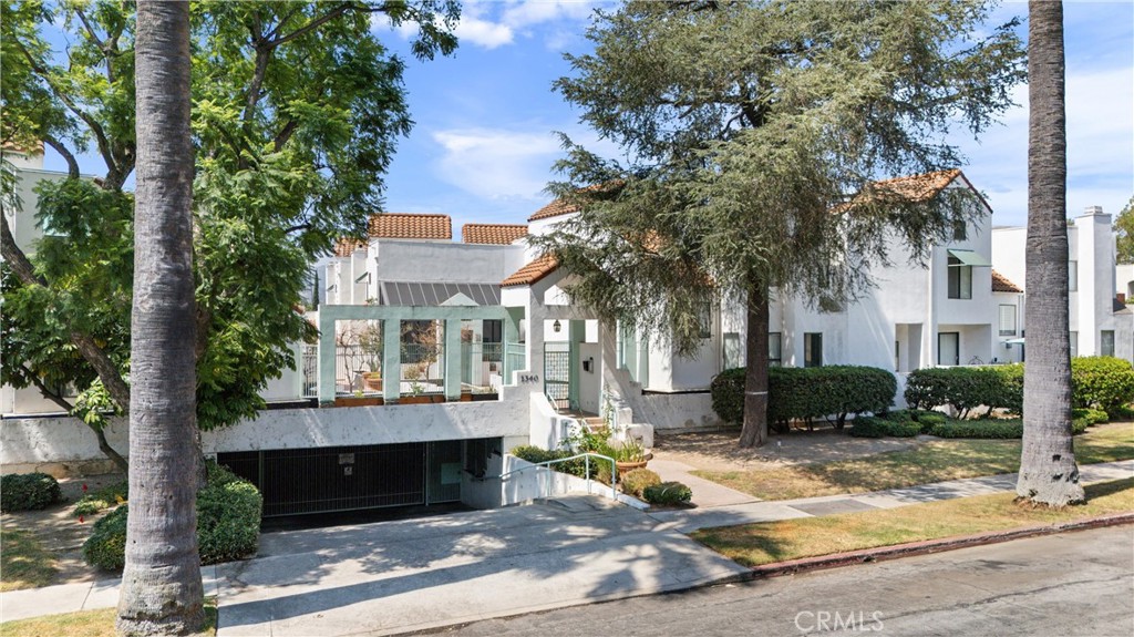 1340 Glenwood Road, Unit 28 Glendale, CA 91201 - Photo 36 of 36 a view of a building with a yard and trees around