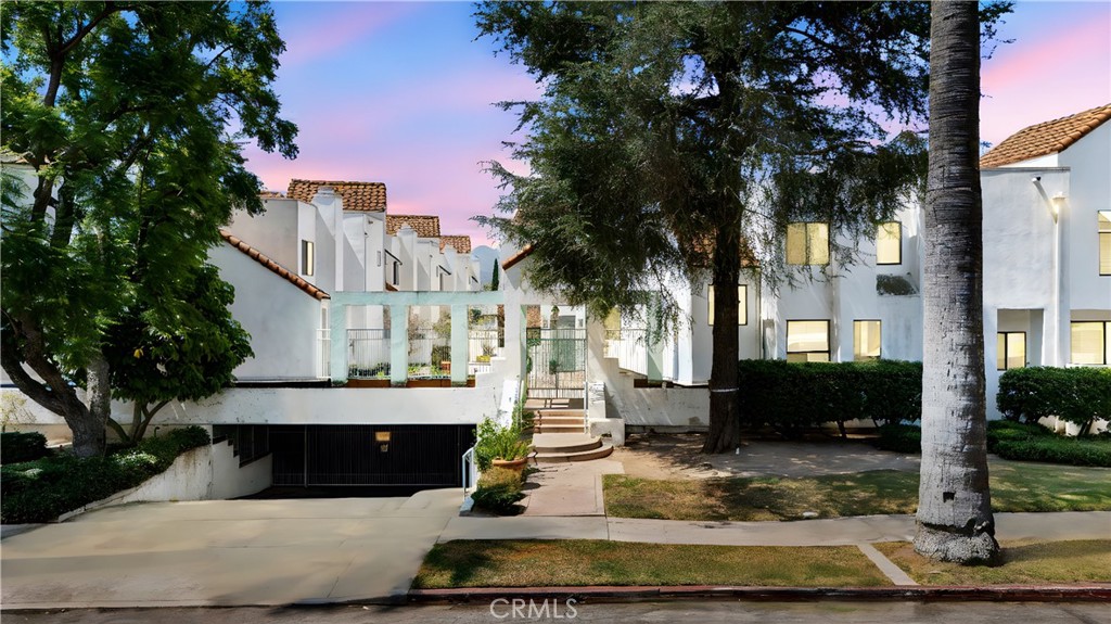 1340 Glenwood Road, Unit 28 Glendale, CA 91201 - Photo 4 of 36 a view of a house with a yard and tree s