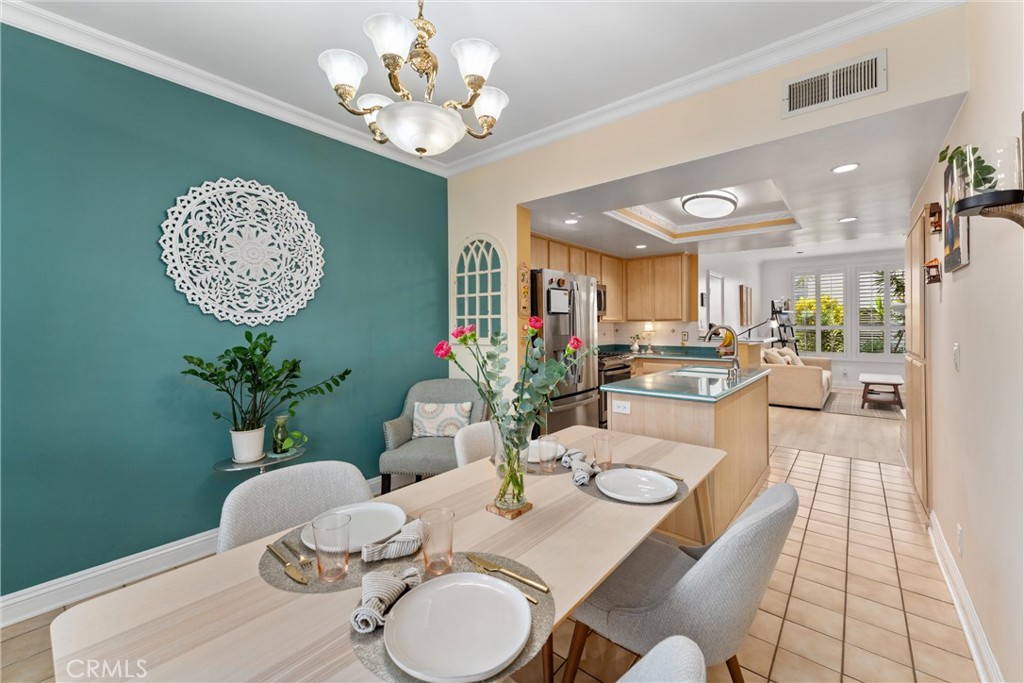 1340 Glenwood Road, Unit 28 Glendale, CA 91201 - Photo 10 of 36 a view of a dining room with furniture and chandelier