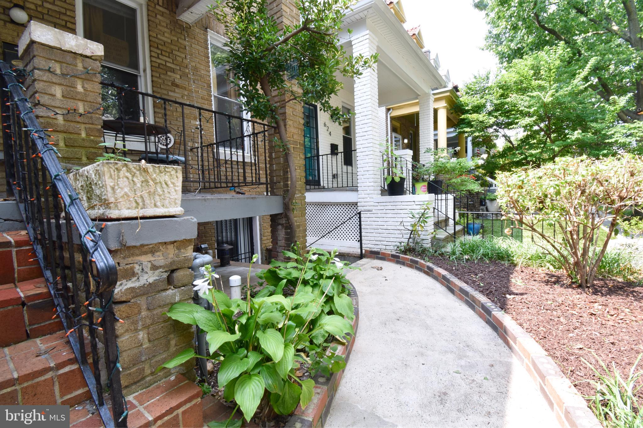 620 Princeton Place Northwest, Unit B Washington, DC 20010 - Photo 2 of 13 a house with lots of trees in front of it