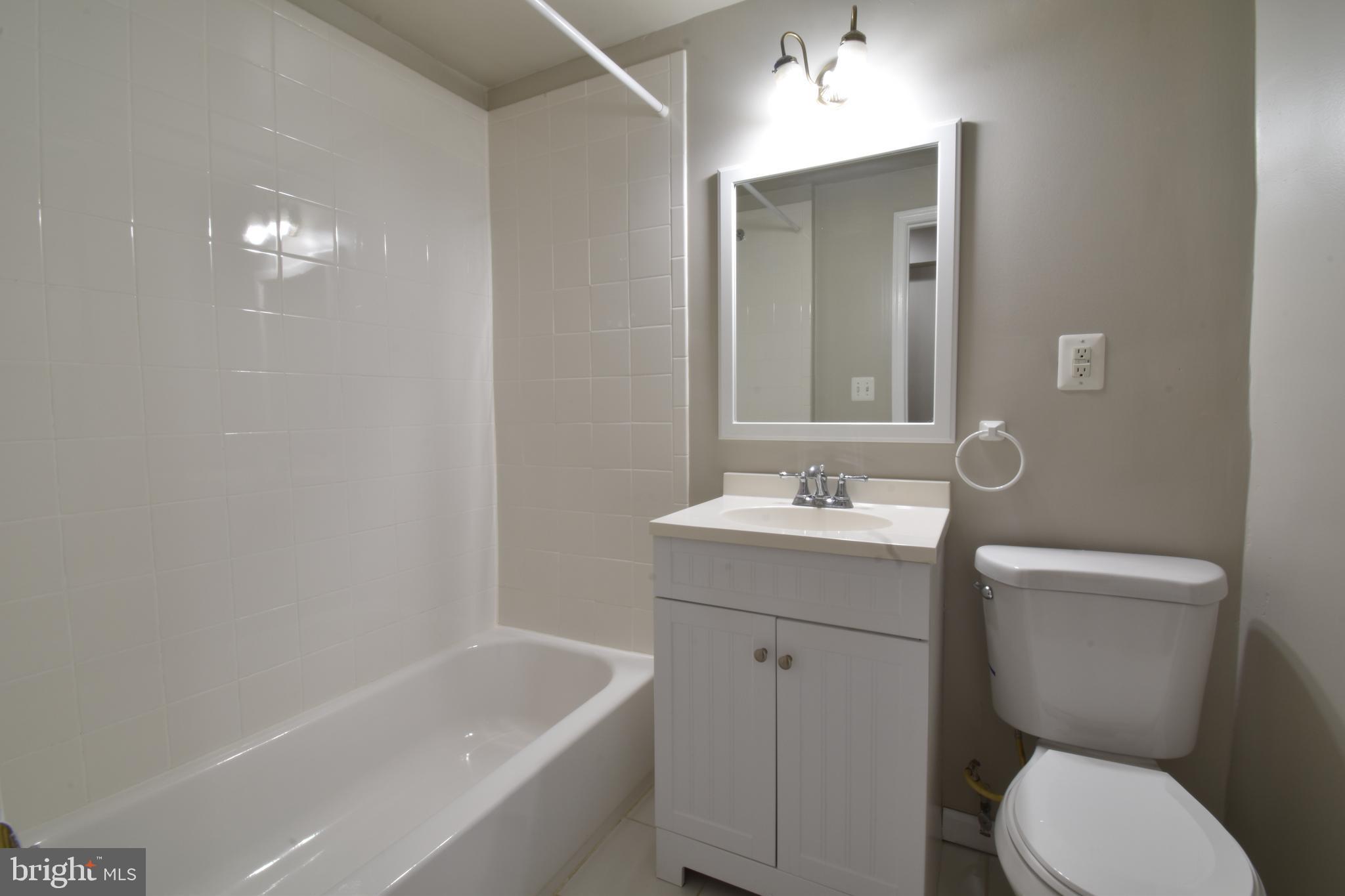 620 Princeton Place Northwest, Unit B Washington, DC 20010 - Photo 6 of 13 a bathroom with a sink a toilet and shower