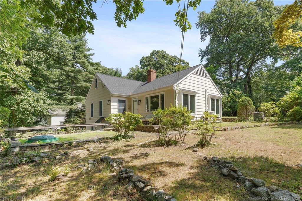 8 Ledge Road Norwalk, CT 06853 - Photo 1 of 1 a front view of a house with garden