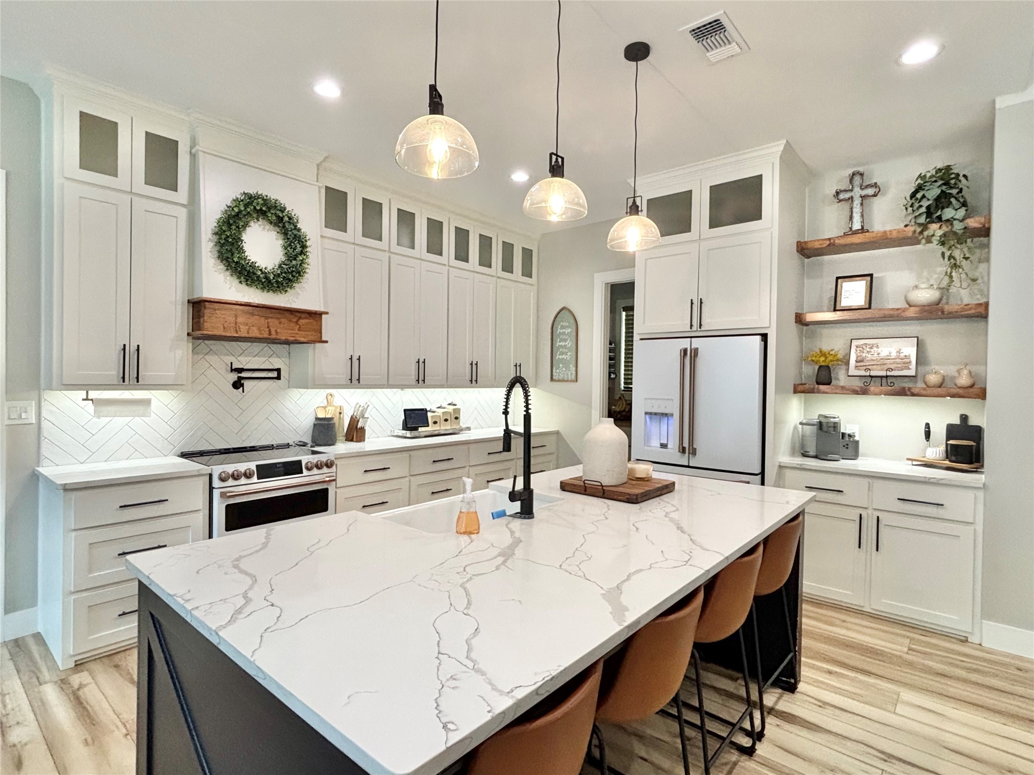 6540 Fm 3065 Colmesneil, TX 75938 - Photo 17 of 49 a kitchen with a white center island and cabinets